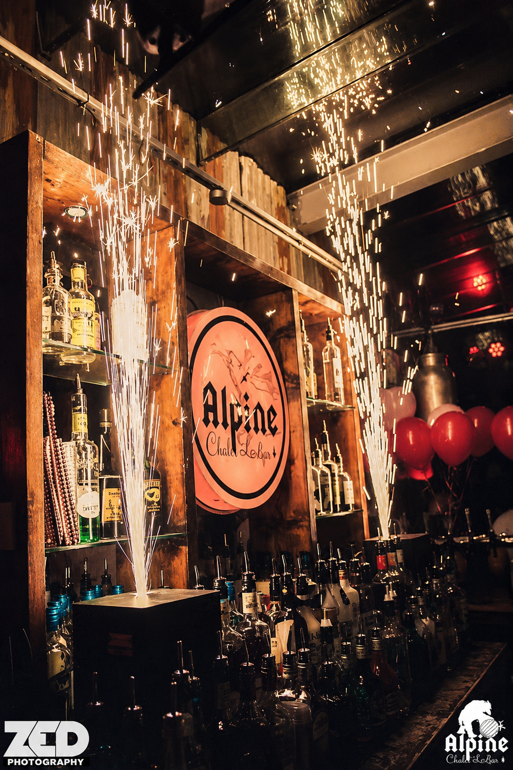 Inside Alpine Cocktail Bar in Ormskirk with indoor spark fountains and balloons